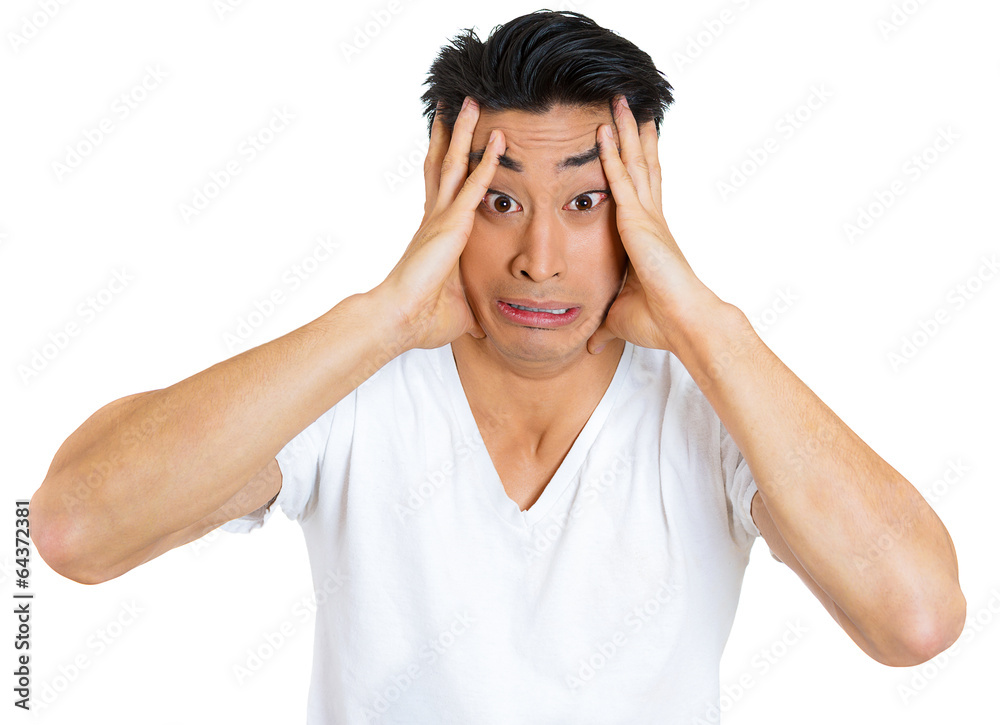 Frustration fear headache. Stressed young man, white background Frustration fear headache. Stressed young man, white background