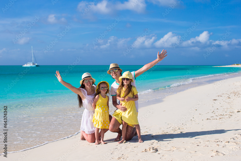 Young beautiful family with two kids on caribbean vacation