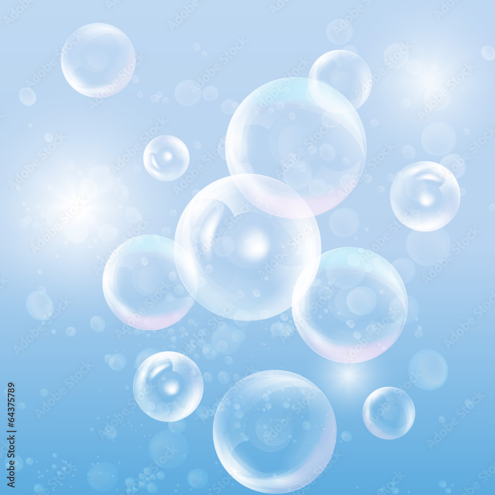 Group of transparent spheres on blue background