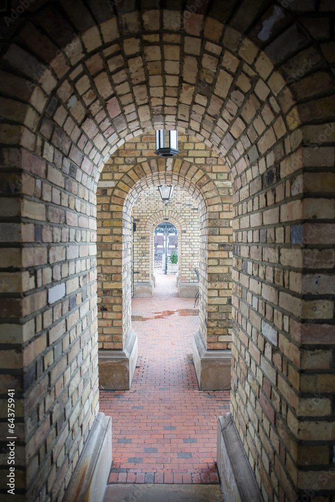 beautiful old brick arch tunnel
