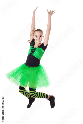 Happy girl in tutu skirt jumping