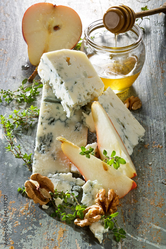 Blue cheese with fresh pear, walnuts and honey photo