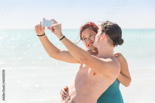 Young Couple Taking Selfie at Beach © william87