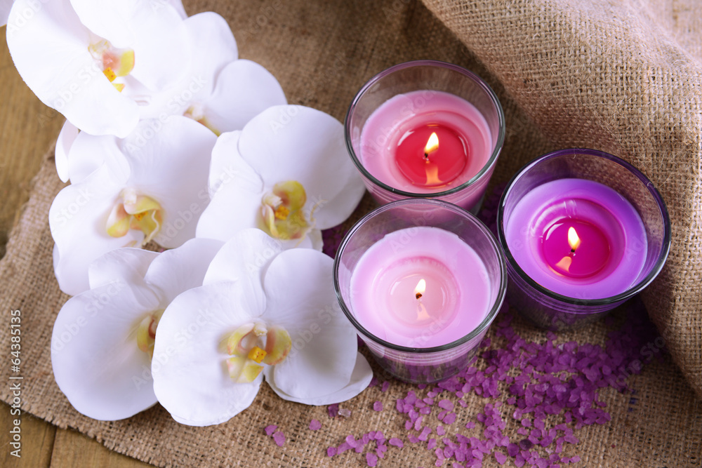 Composition with beautiful colorful candles, sea salt and