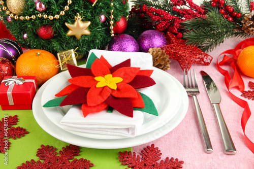 Christmas table setting with festive decorations close up