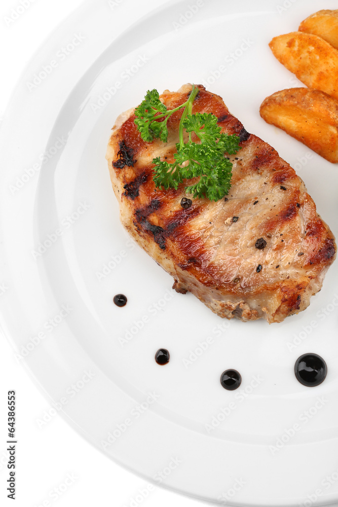 Grilled steak and fried potato pieces isolated on white Grilled steak and fried potato pieces isolated on white