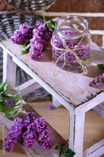 Beautiful lilac flowers in vase,