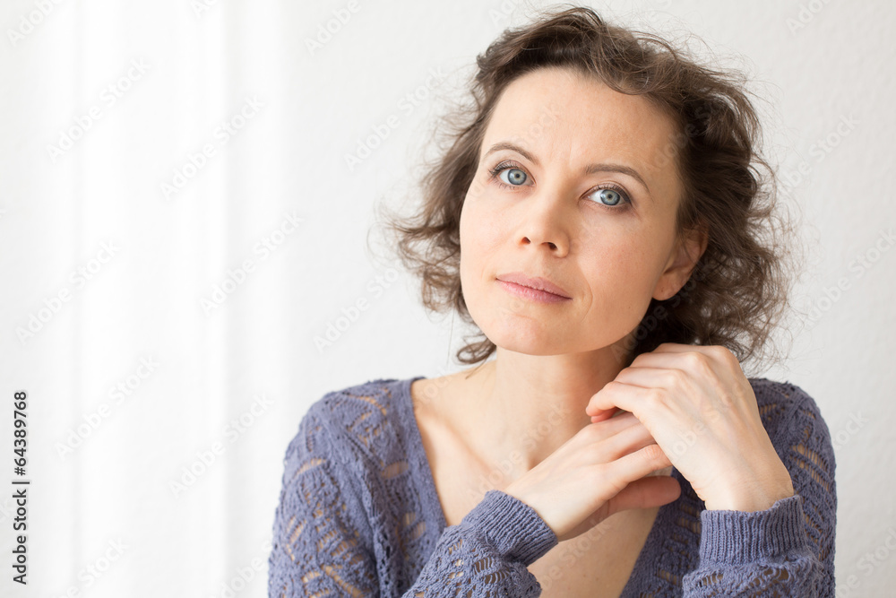 Romantic woman looking into camera with smile Romantic woman looking into camera with smile