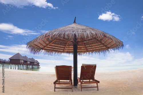 Fototapeta Naklejka Na Ścianę i Meble -  water villa with umbrella and beach chair .maldives