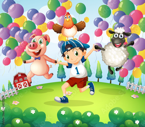 A boy and his animals at the farm with floating balloons