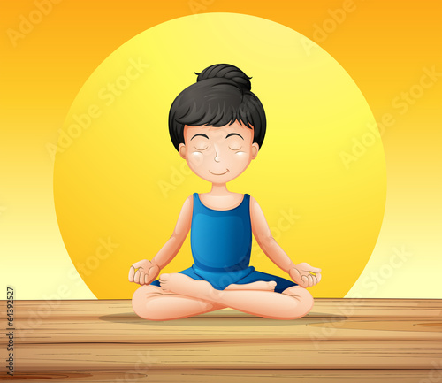 A girl concentrating while doing yoga