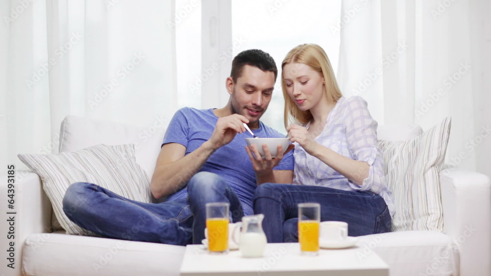 smiling couple having breakfast at home smiling couple having breakfast at home