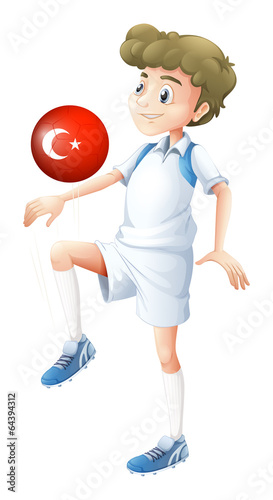 A football player using the ball with the flag of Turkey
