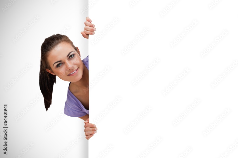 Composite image of pretty brunette showing card Composite image of pretty brunette showing card