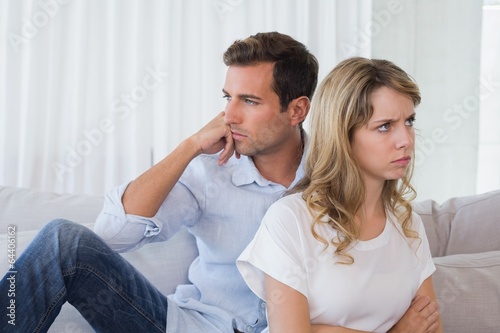 Couple not talking after an argument in living room © lightwavemedia