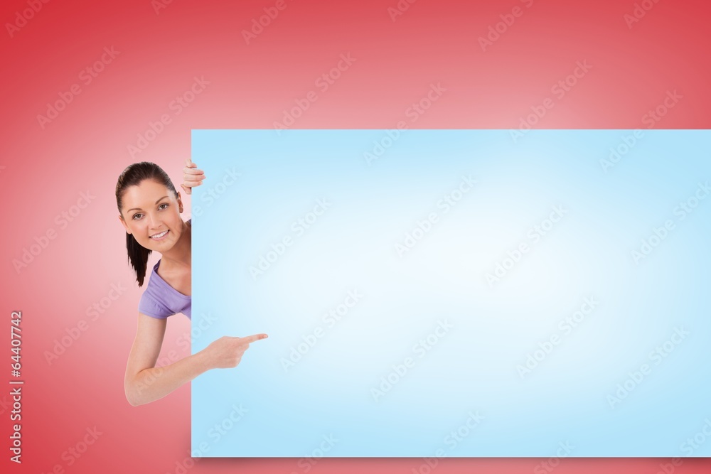 Composite image of pretty brunette showing card Composite image of pretty brunette showing card