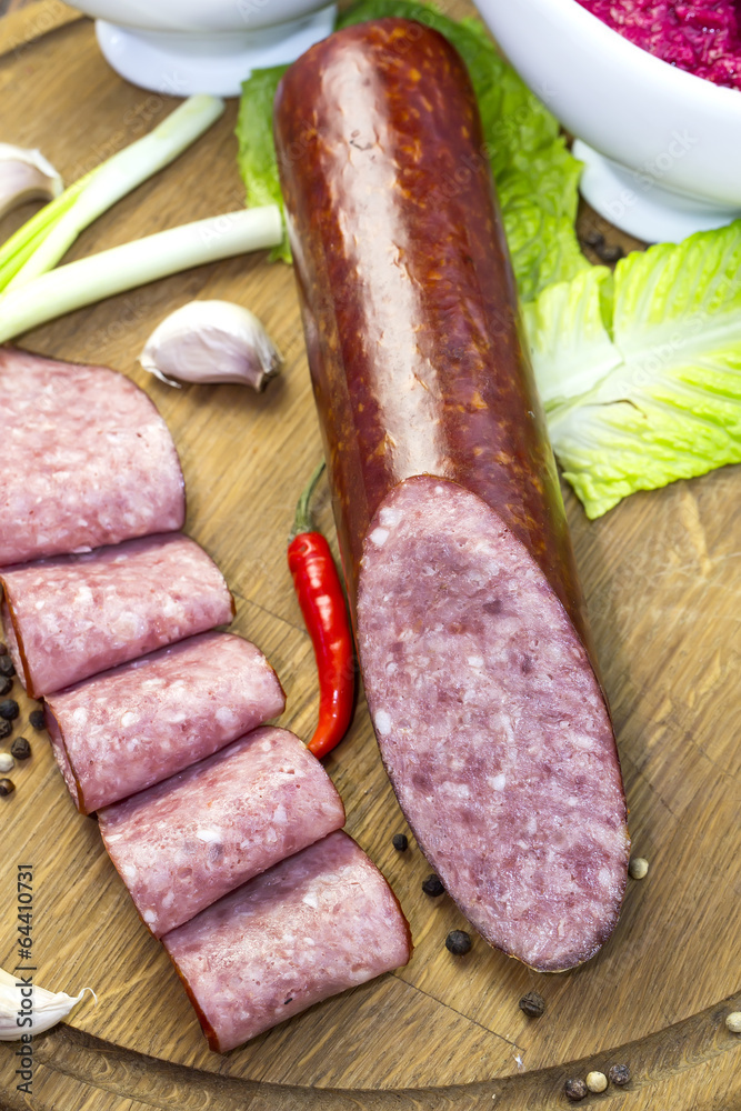 sausage on a wooden plate in a restaurant sausage on a wooden plate in a restaurant