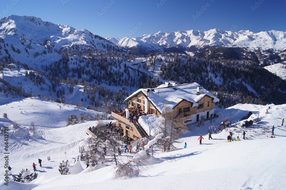 Snowy hut on slopes