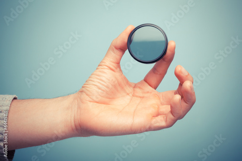 Hand holding polarizer filter