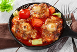 fried oxtail in red sauce with vegetables