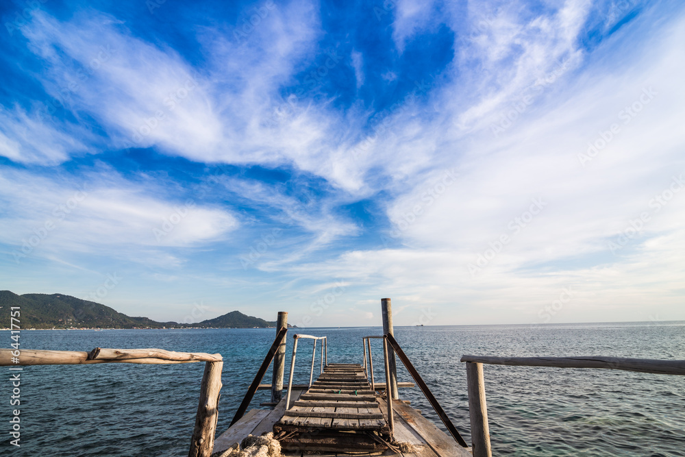 Fototapeta premium Wooden walkway over the sand dunes to the beach