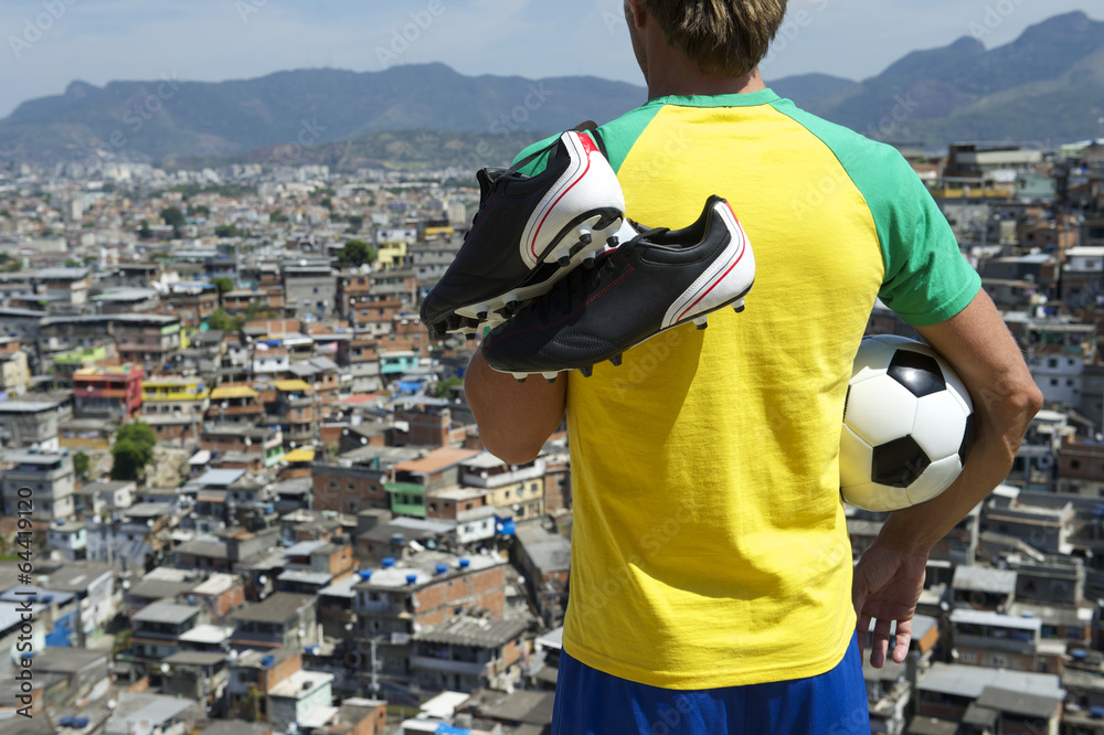 Naklejka premium Brazilian Football Player in Kit Holding Soccer Ball Favela