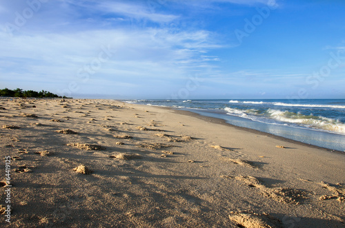 Fototapeta Naklejka Na Ścianę i Meble -  ocean and sandy beach on blue sky background