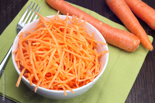 Julienne carrots in white bowl