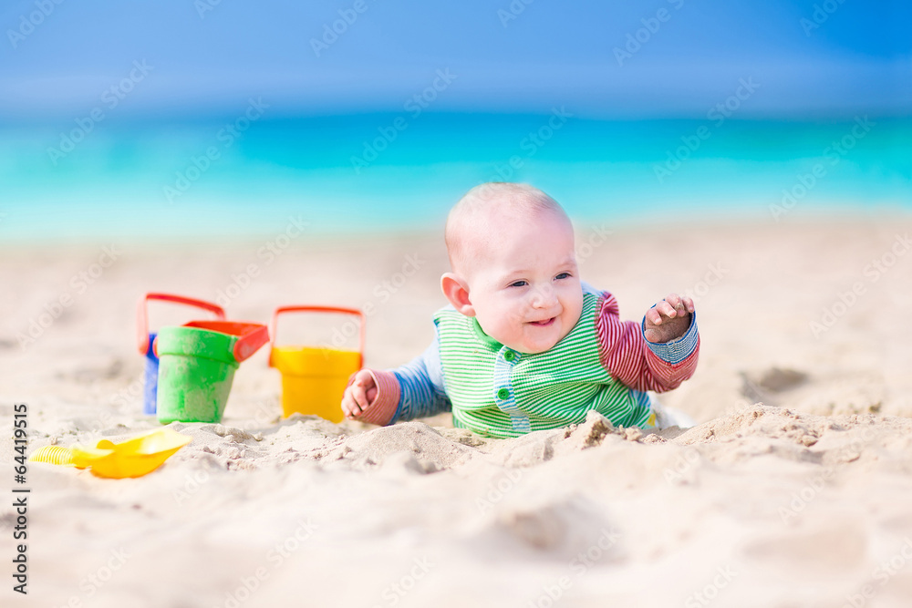 Funny baby playing on the beach Funny baby playing on the beach
