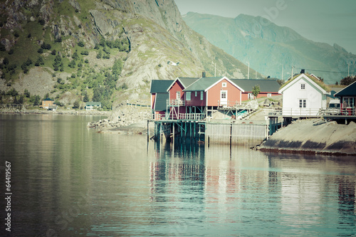 Typical Norwegian fishing village with traditional red rorbu hut