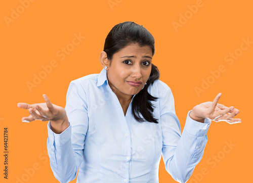 who cares! Ignorant clueless young woman on orange background 