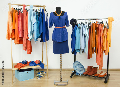 Dressing closet with complementary color blue and orange clothes