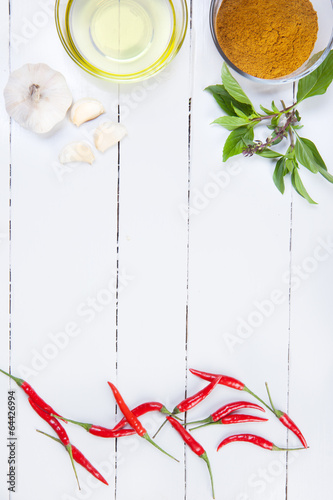 curry ingredients on white wooden board photo