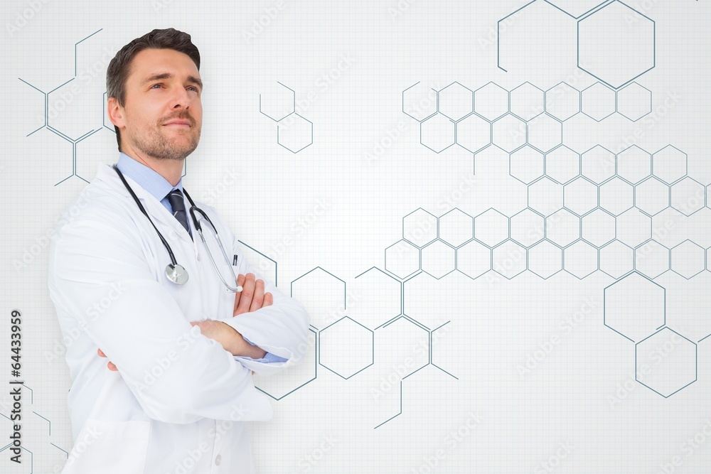 Composite image of handsome young doctor with arms crossed Composite image of handsome young doctor with arms crossed