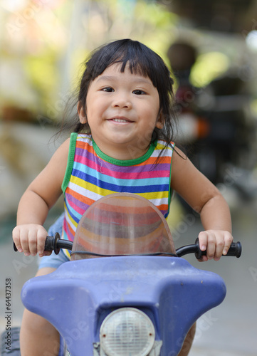 Cute asian girl  enjoy playing toy car © kwanchaichaiudom