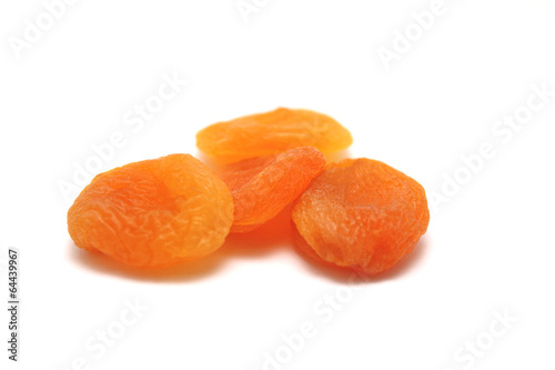Dried apricots on a white background with a light shadow