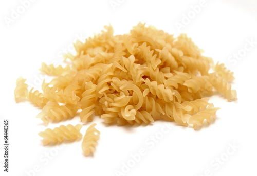 Raw Italian pasta made ​​from durum wheat on a white background