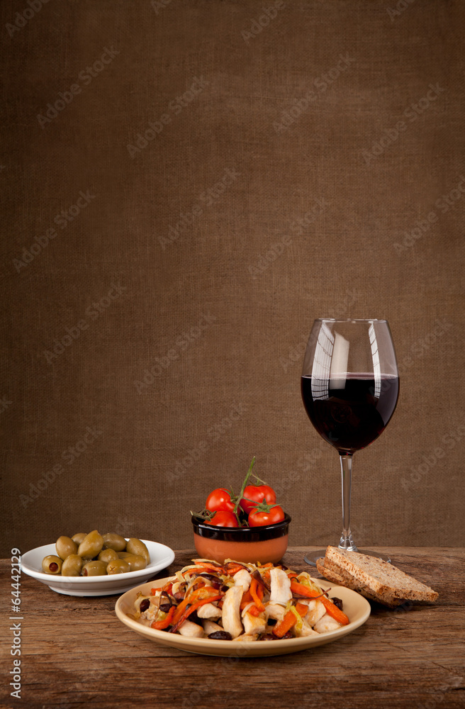 Lunch with wine, olives, tomatoes and bread