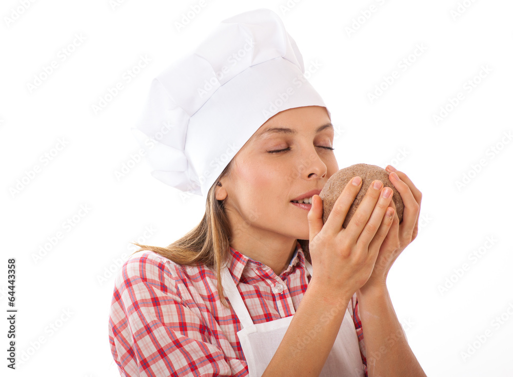 Baker smelling bread dough to check quality Baker smelling bread dough to check quality