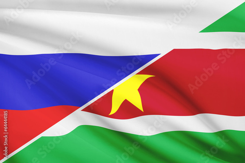 Series of ruffled flags. Russia and Republic of Suriname.
