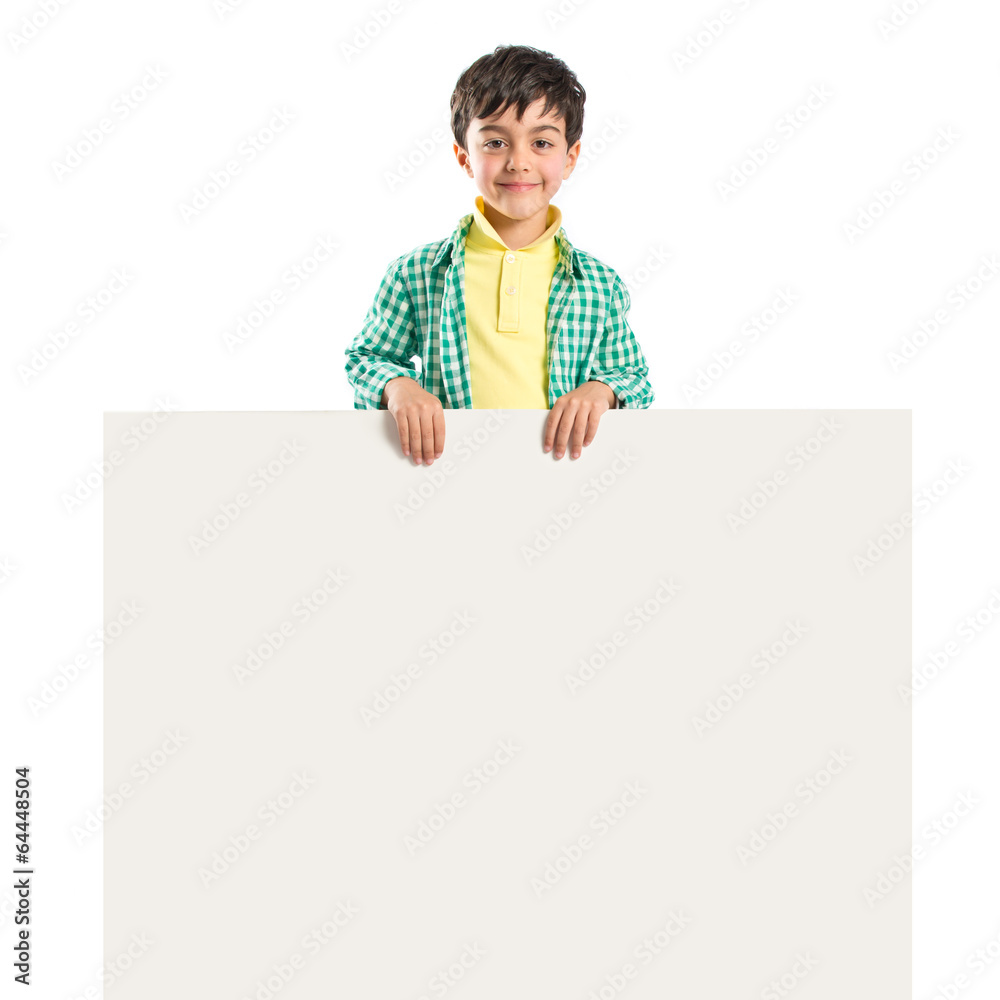 Kid holding empty placard over white background Kid holding empty placard over white background