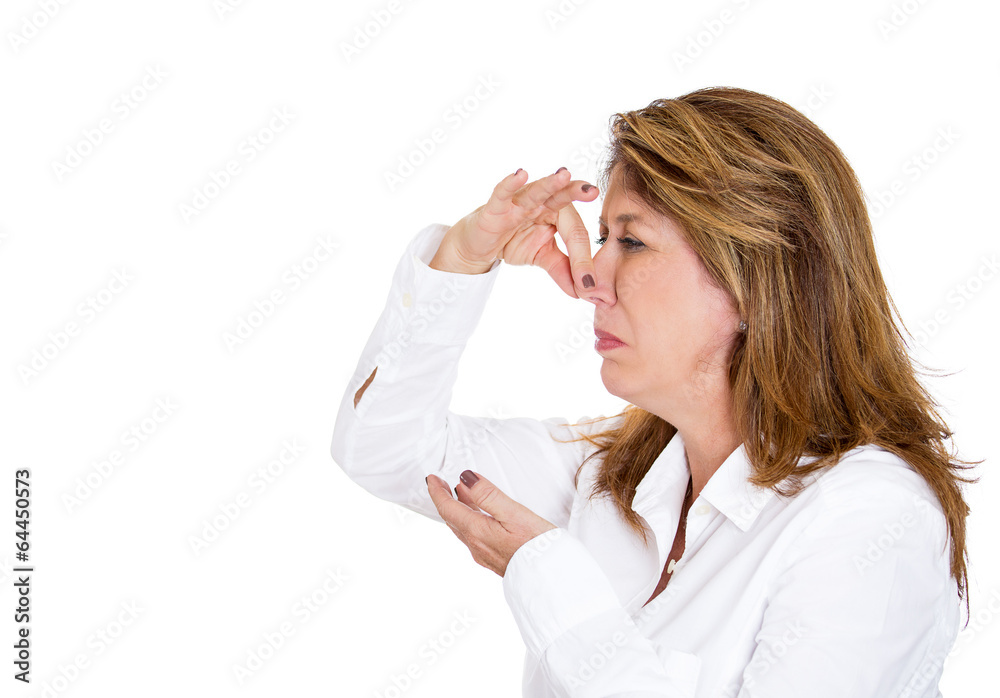 Something stinks. Woman pinches her nose doesn't like smell Something stinks. Woman pinches her nose doesn't like smell