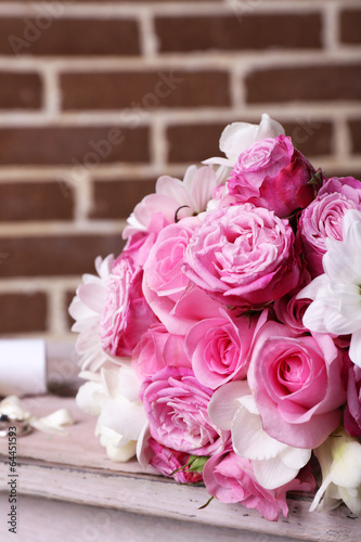Beautiful wedding bouquet on bricks wall background