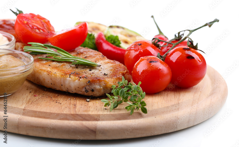 Grilled steak with spices, herbs and vegetables