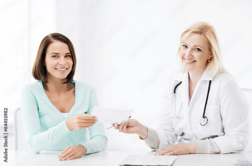 doctor giving prescription to patient in hospital doctor giving prescription to patient in hospital