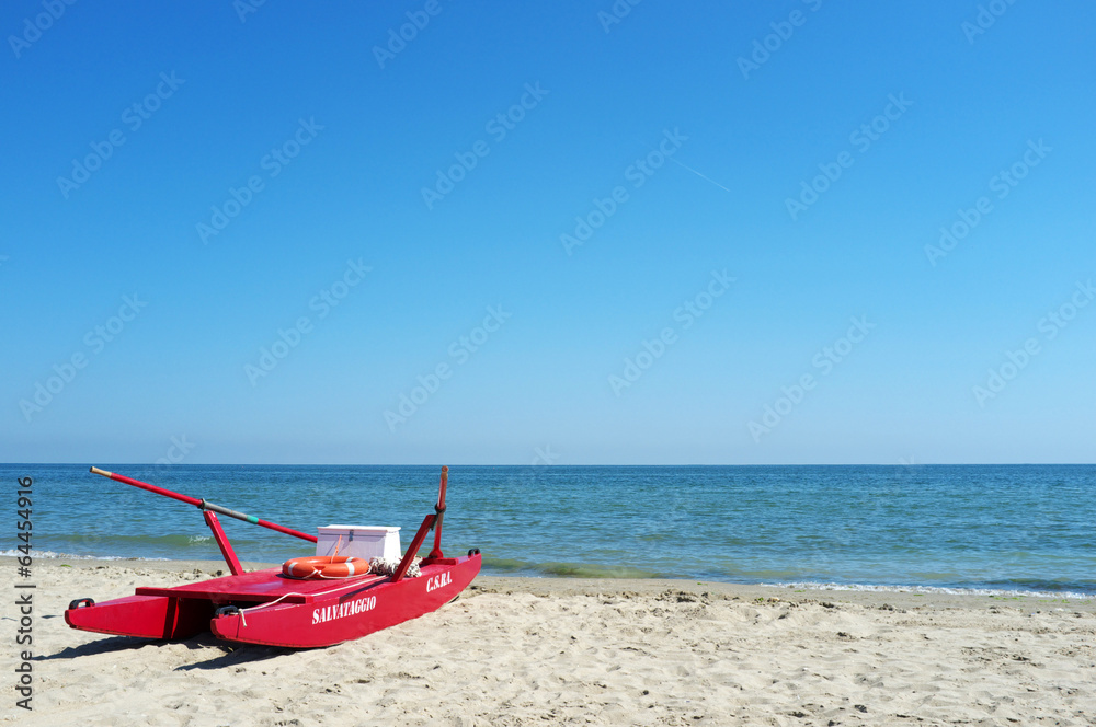 Red rescue boat on an italian beach on the Adriatic sea