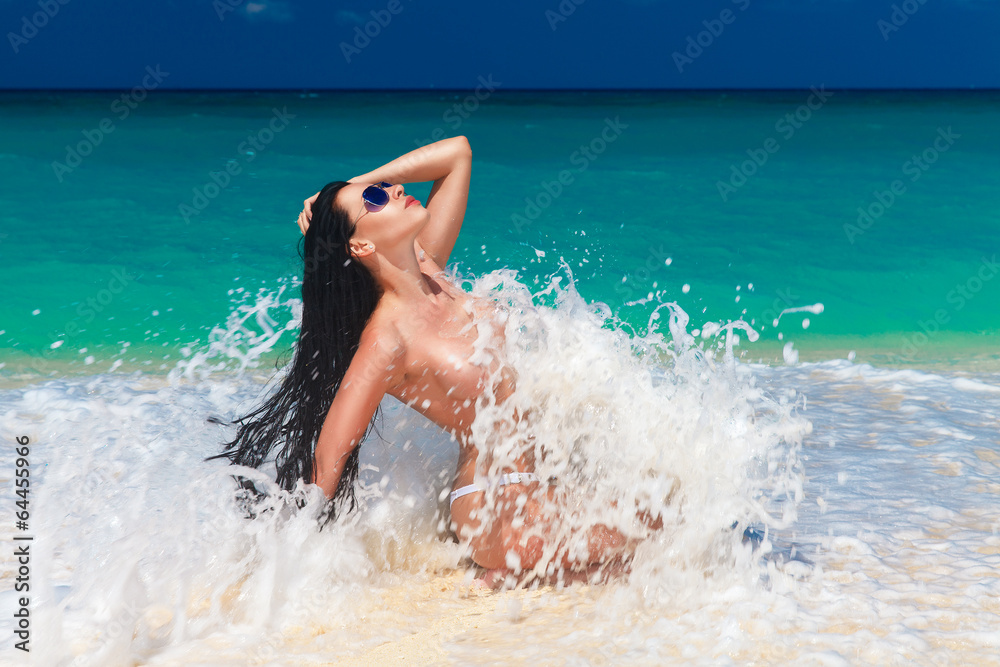 beautiful young brunette enjoying the sun on the tropical coast beautiful young brunette enjoying the sun on the tropical coast