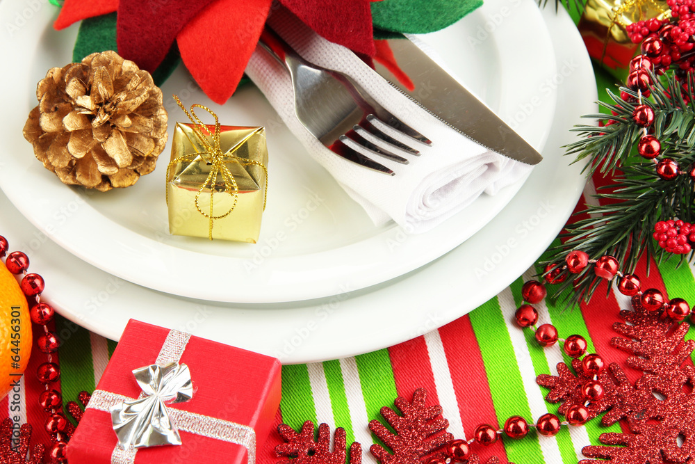 Christmas table setting with festive decorations close up Christmas table setting with festive decorations close up