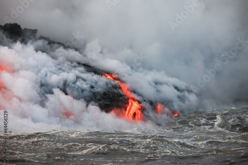Red hot lava flowing into Pacific Ocean on Big Island, Hawaii  © Juancat