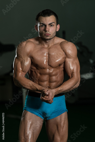 Bodybuilder Performing Most Muscular Poses © Jale Ibrak